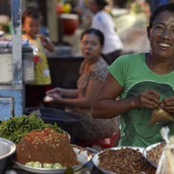 6. Balinese woman at Ubud market stall